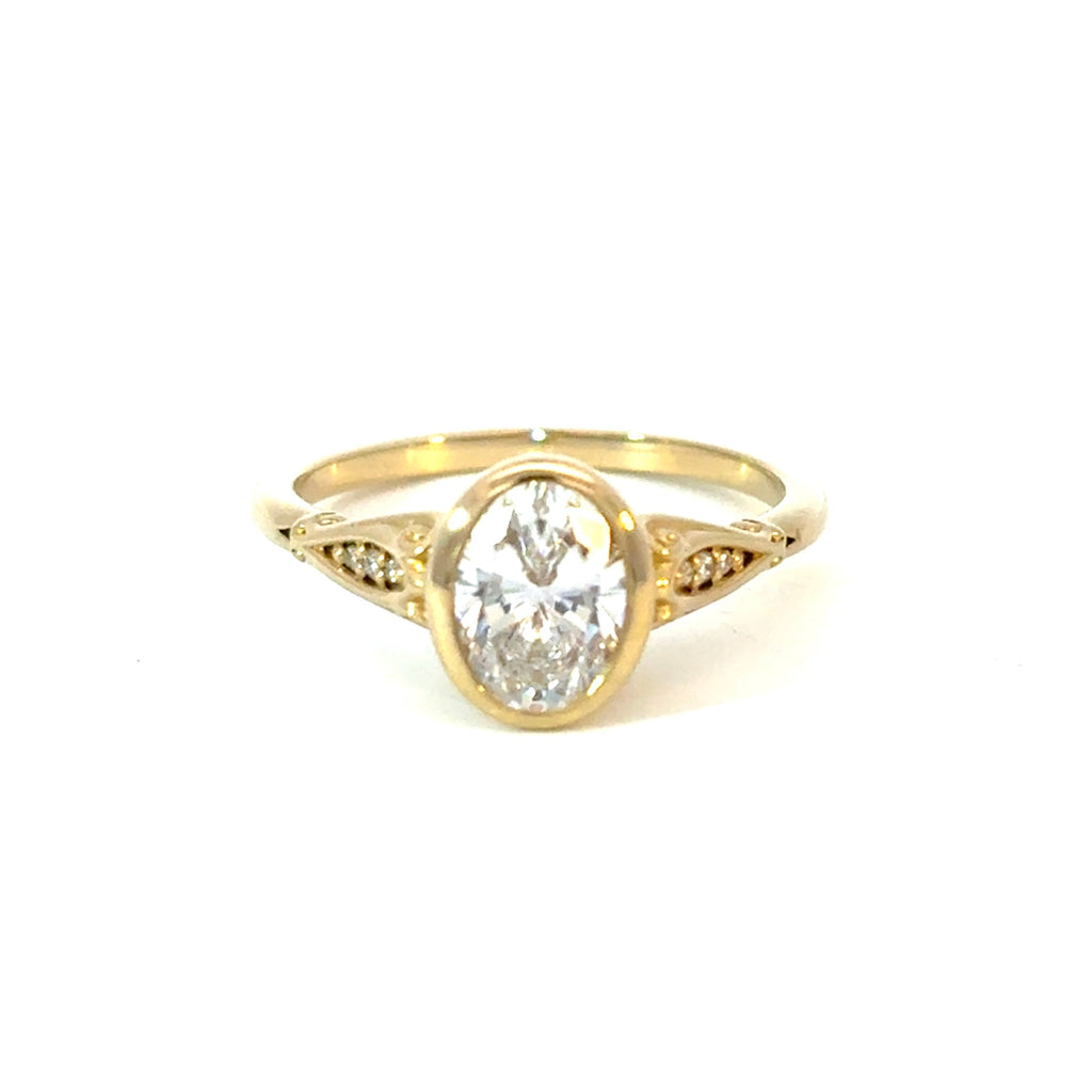 Filligree Oval Accented Engagement Ring with CZ Center Stone