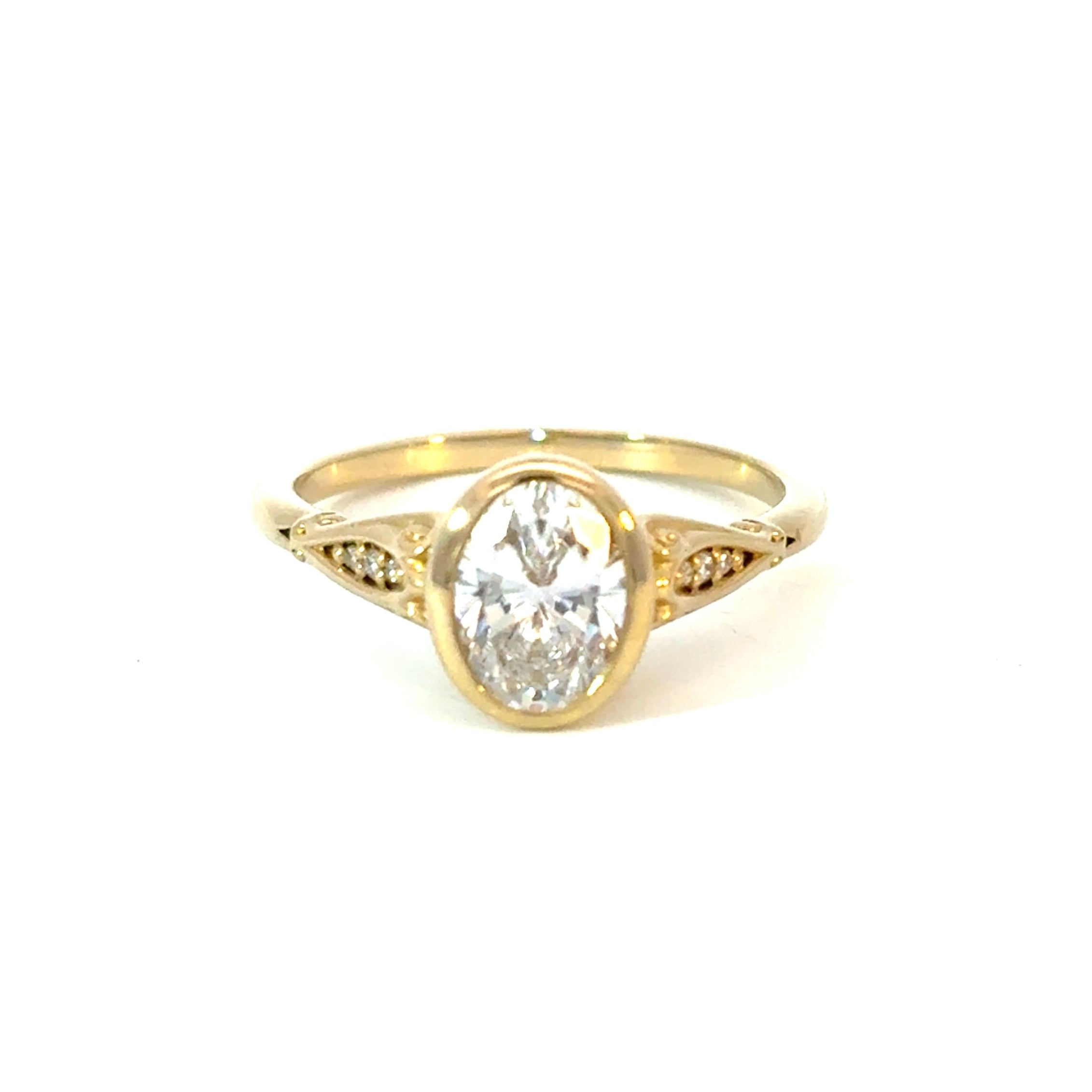 Filligree Oval Accented Engagement Ring with CZ Center Stone