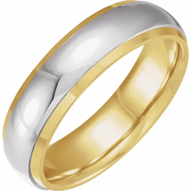 Two-tone gold and silver ring on a white background