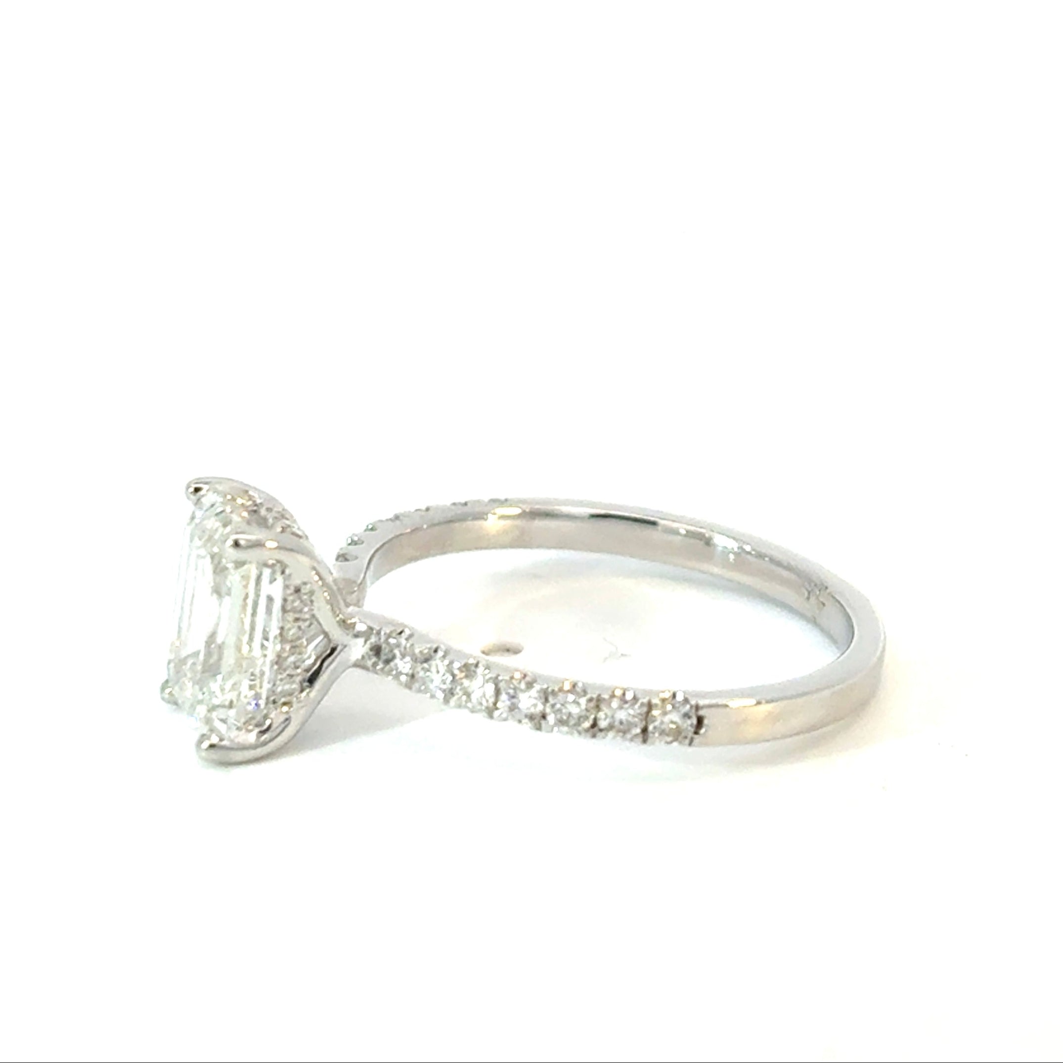 Emerald Cut Diamond Engagement Ring with Side Diamonds and Hidden Halo