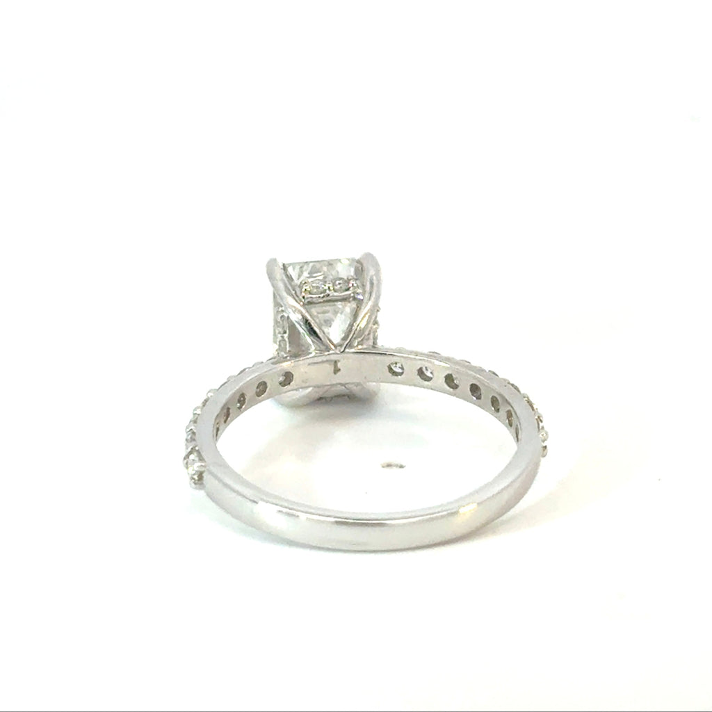 Emerald Cut Diamond Engagement Ring with Side Diamonds and Hidden Halo