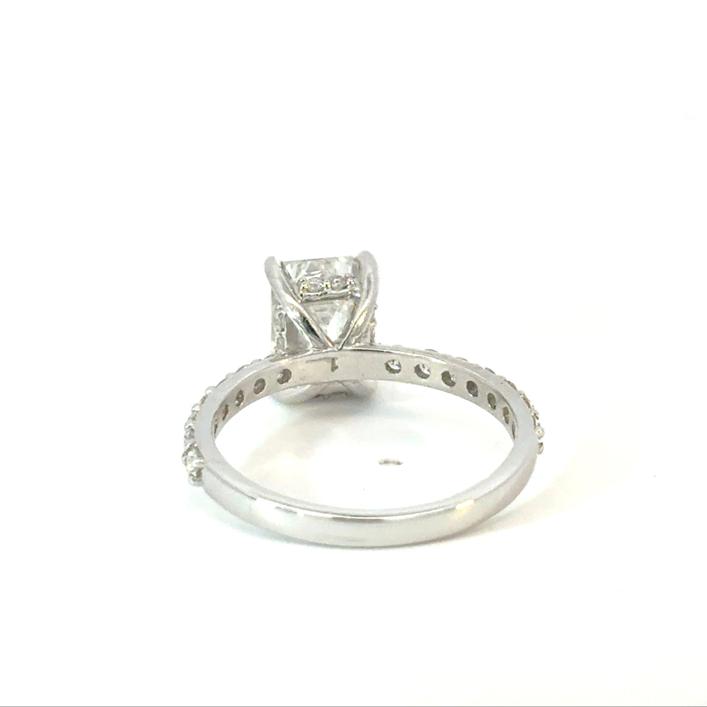 Emerald Cut Diamond Engagement Ring with Side Diamonds and Hidden Halo