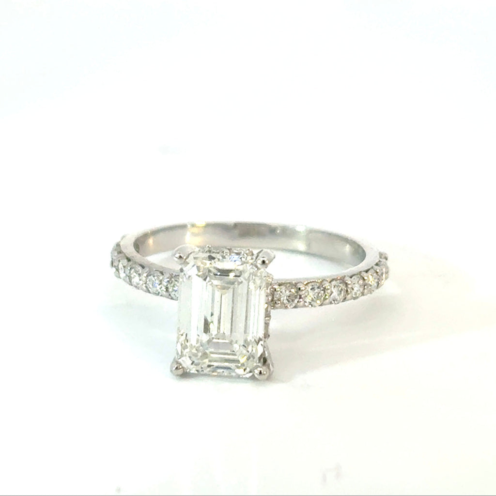Emerald Cut Diamond Engagement Ring with Side Diamonds and Hidden Halo