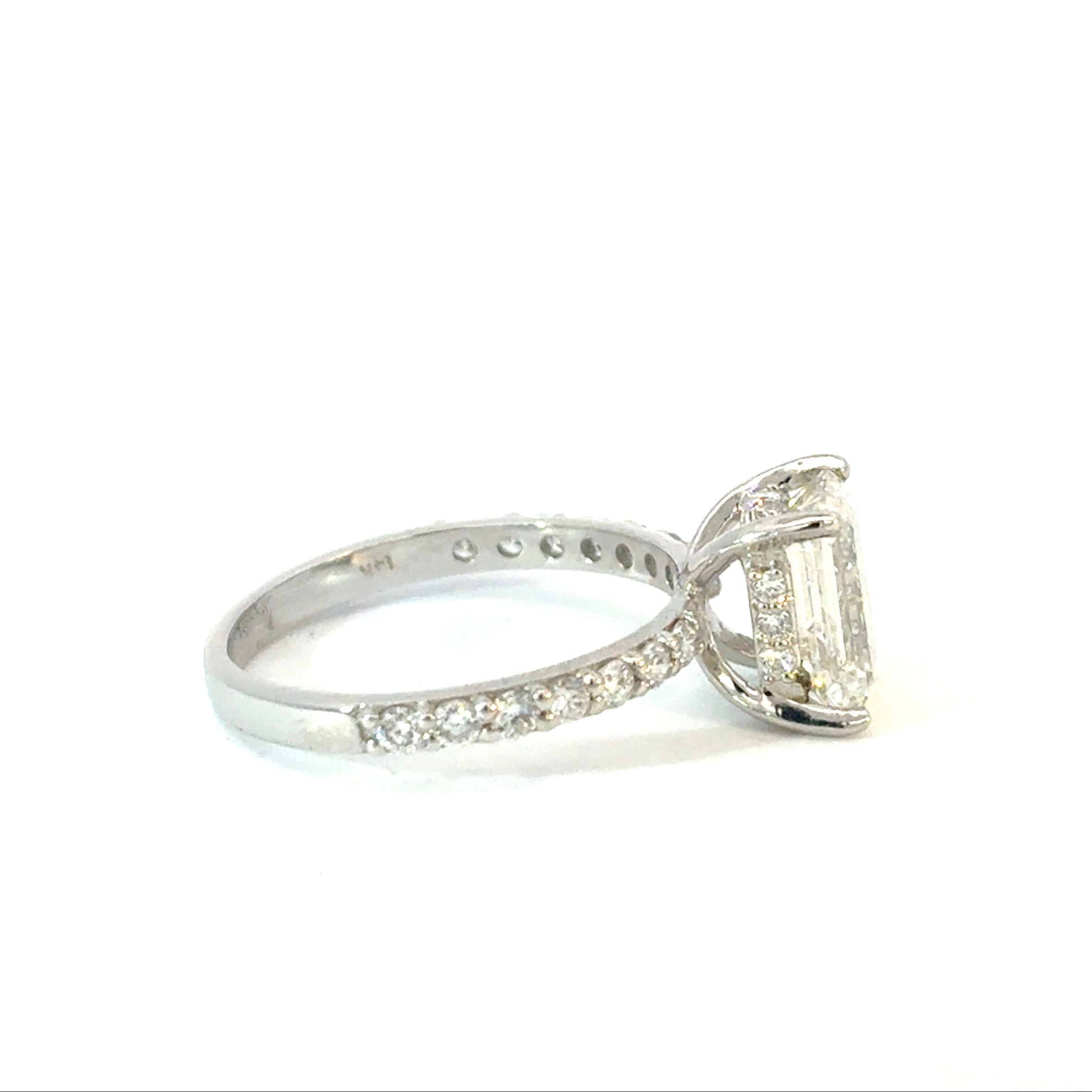 Emerald Cut Diamond Engagement Ring with Side Diamonds and Hidden Halo