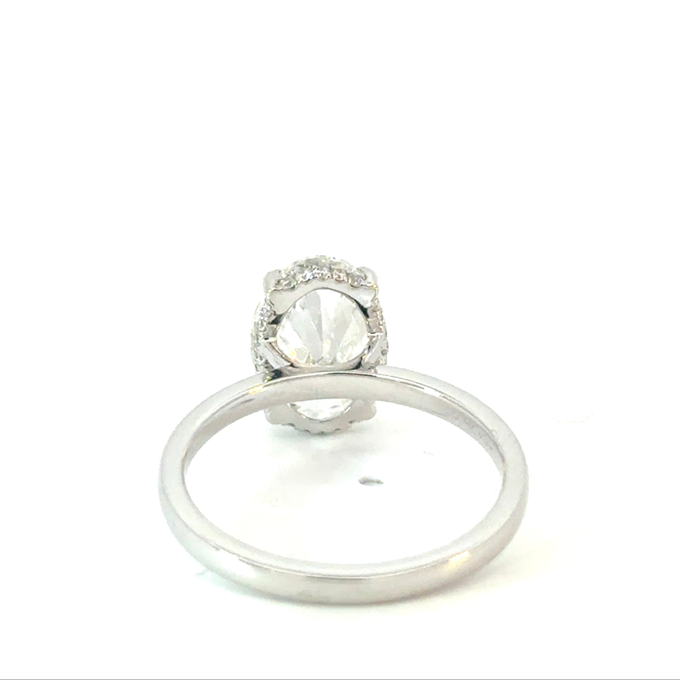 Oval Cut Diamond Engagement Ring with Hidden Halo