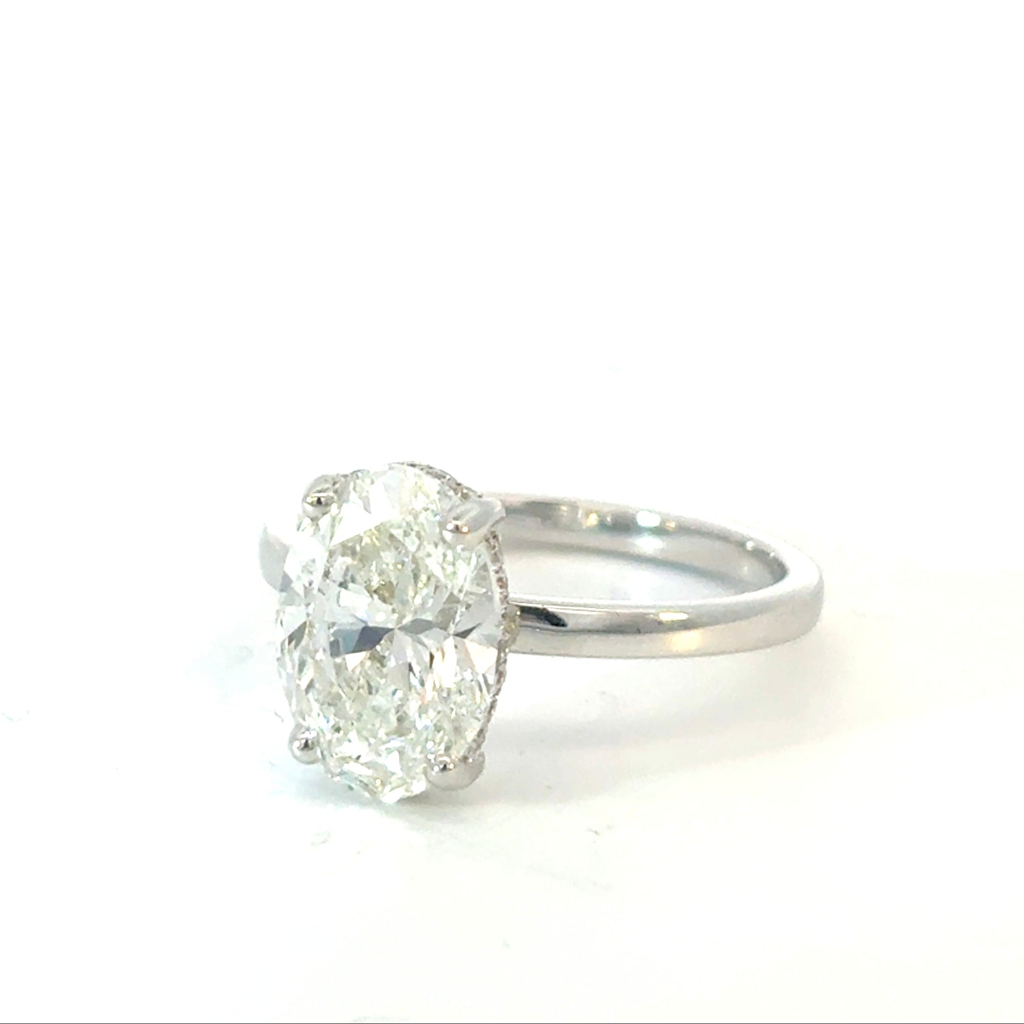 Oval Cut Diamond Engagement Ring with Hidden Halo