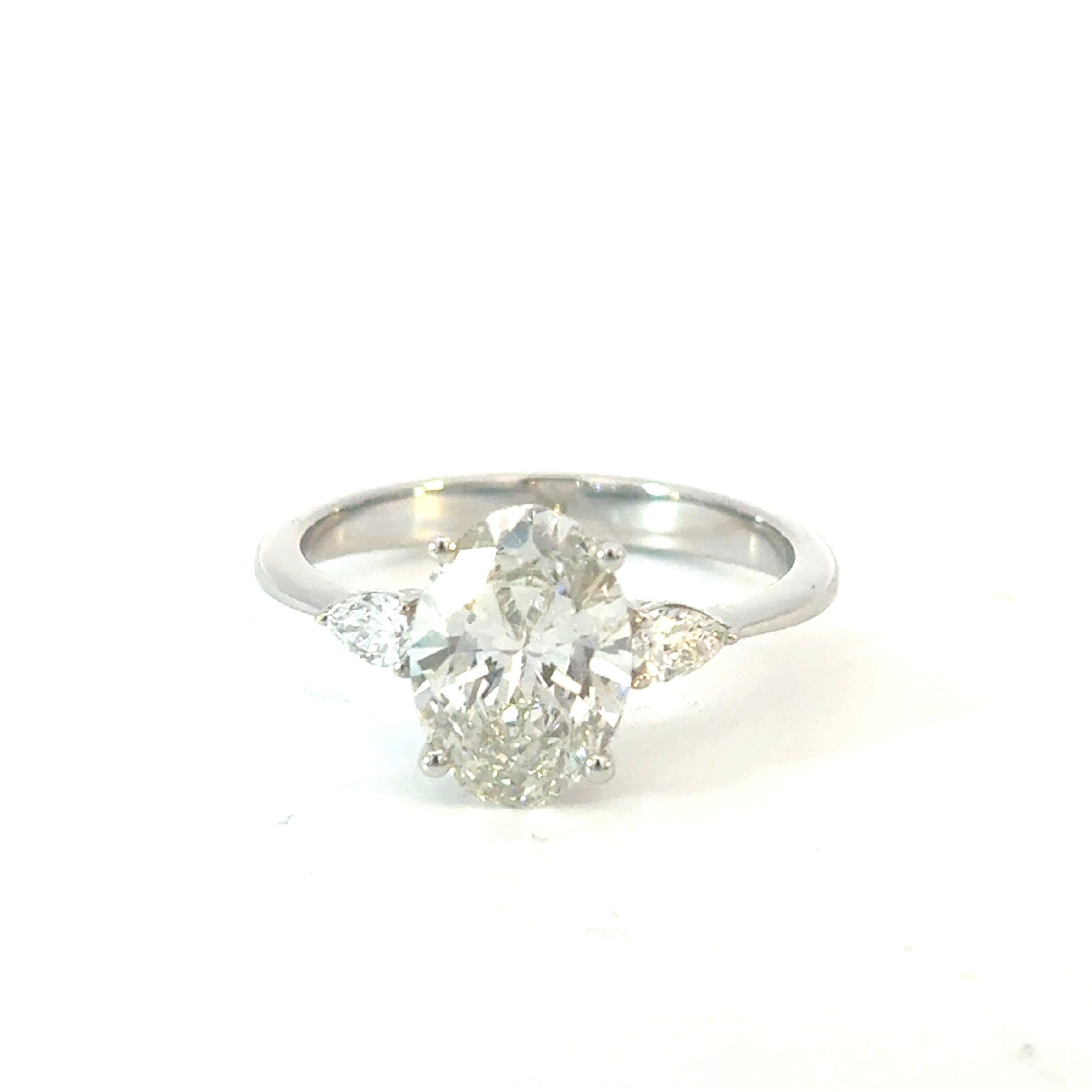 Oval Cut Diamond Engagement Ring with Pear Side Stones