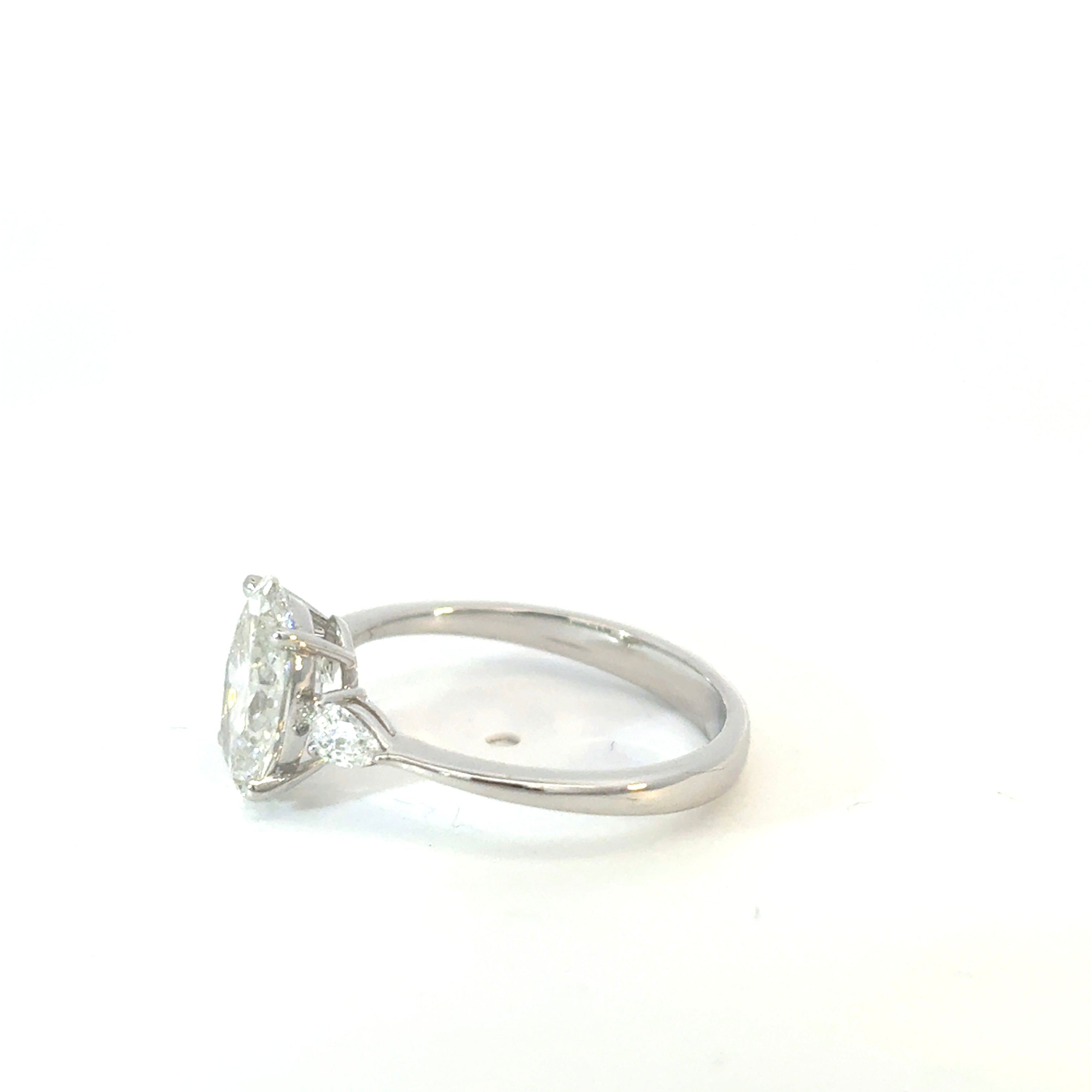 Oval Cut Diamond Engagement Ring with Pear Side Stones