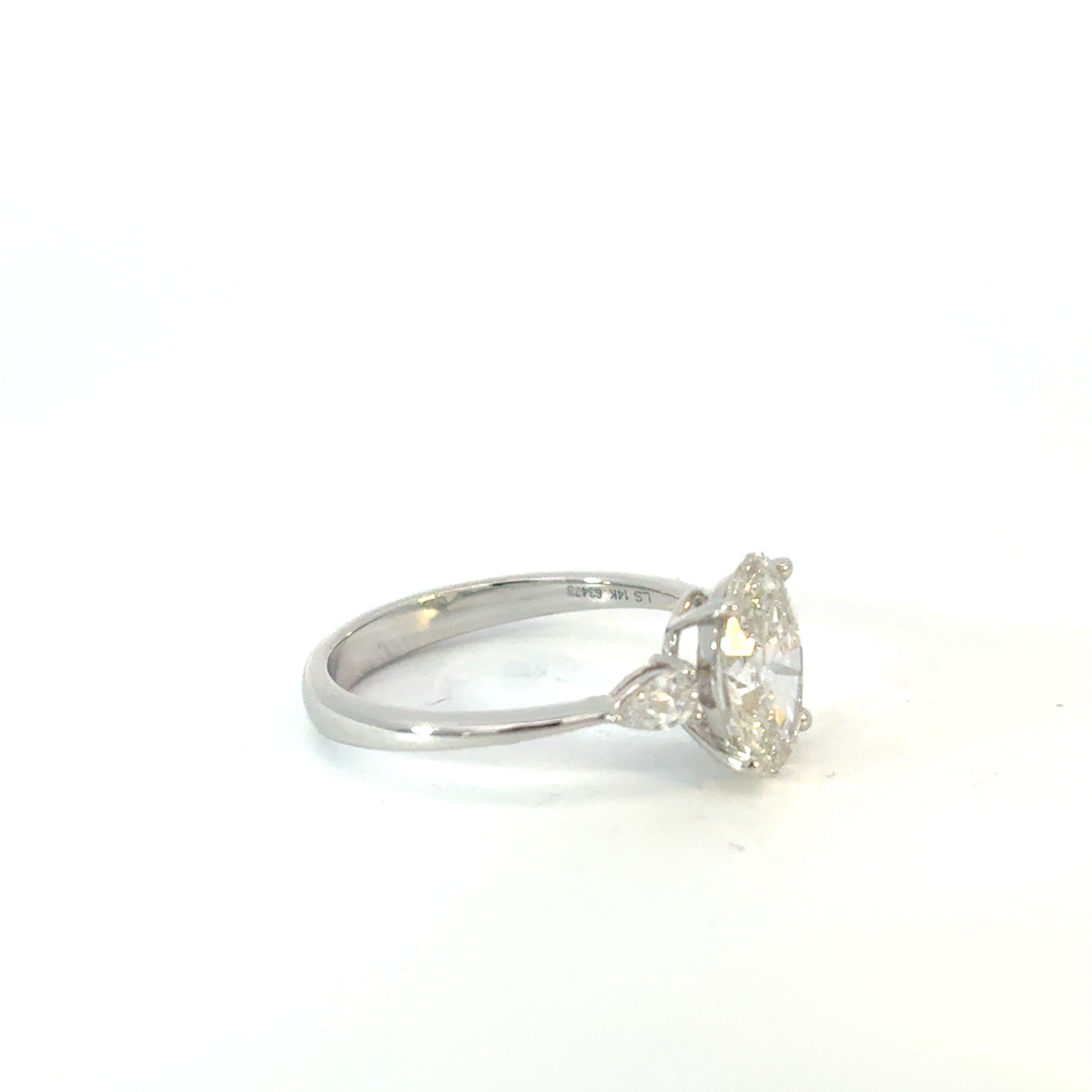 Oval Cut Diamond Engagement Ring with Pear Side Stones