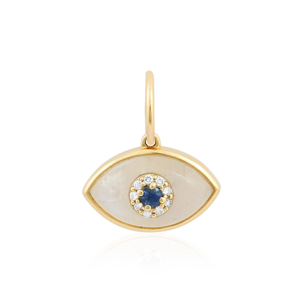 Gold pendant with a blue gemstone and clear stones on a white background