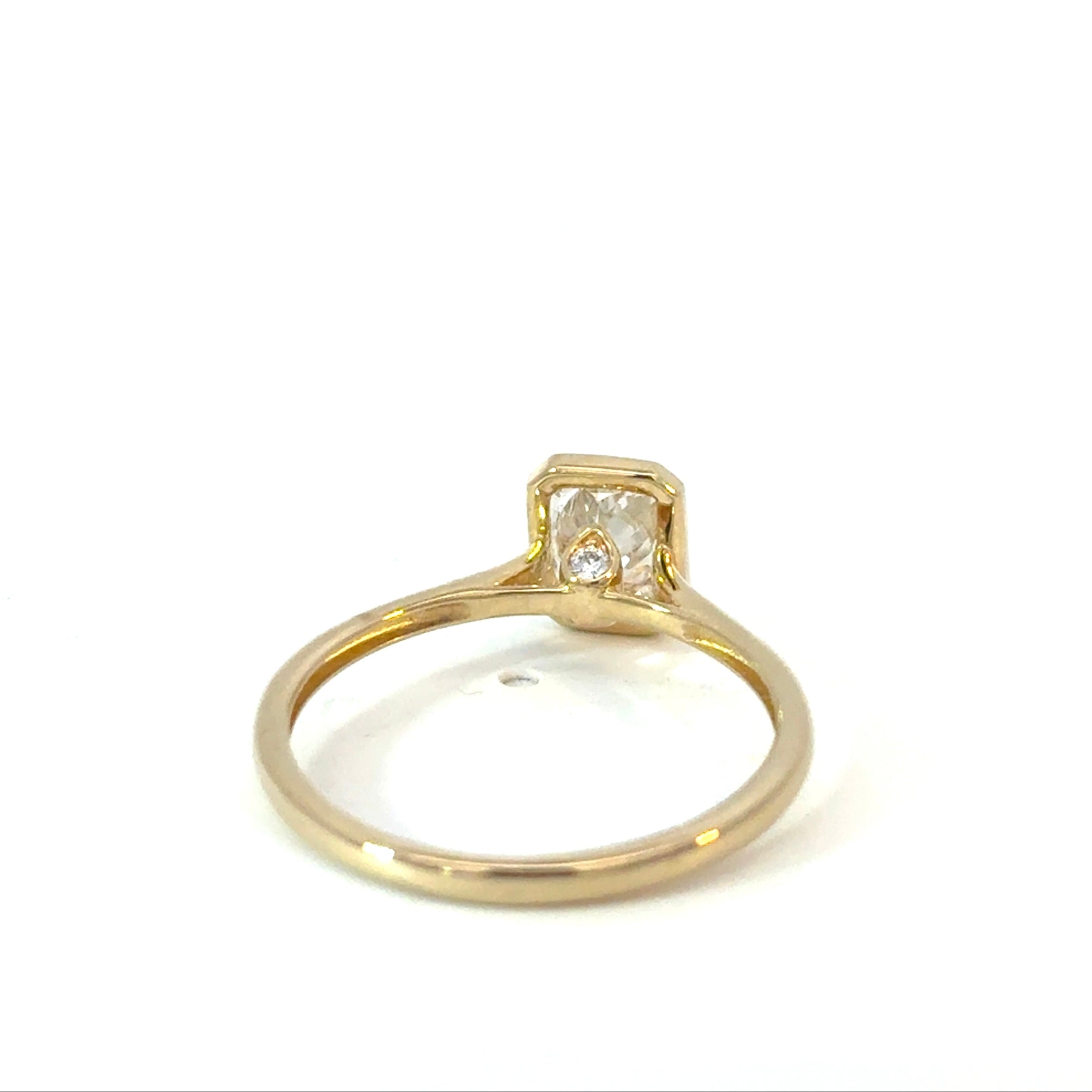 Emerald Cut Diamond Engagement Ring with Hidden Diamond