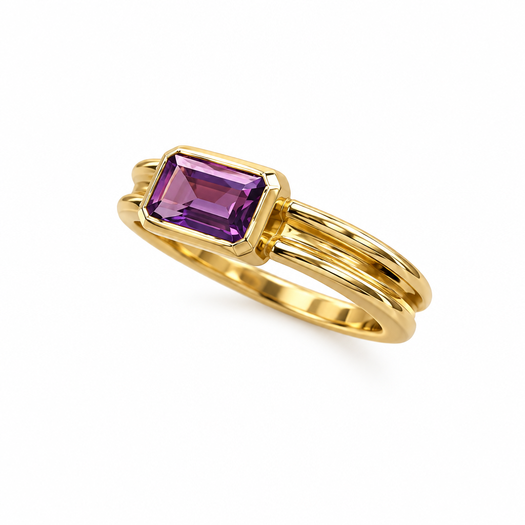 Angled side view of gold amethyst bezel ring on white background