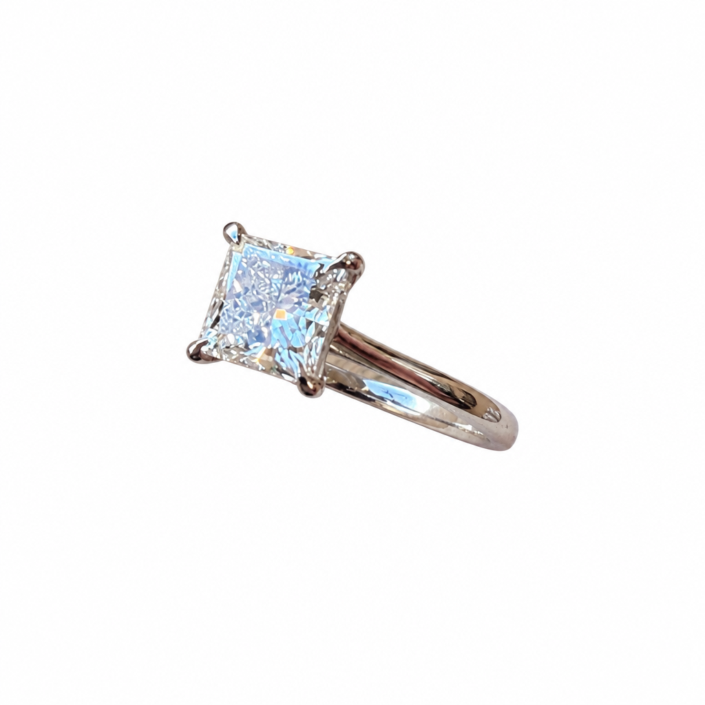 Princess-cut diamond engagement ring angled view on white background