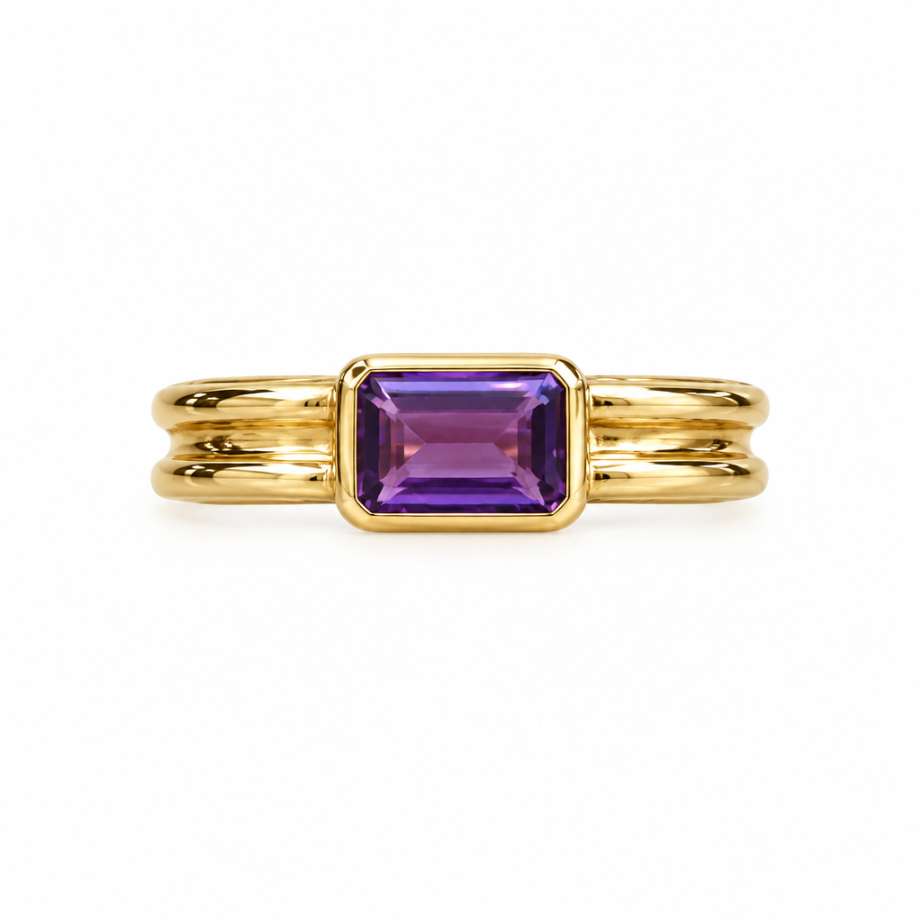 Front view of gold amethyst bezel ring on white background