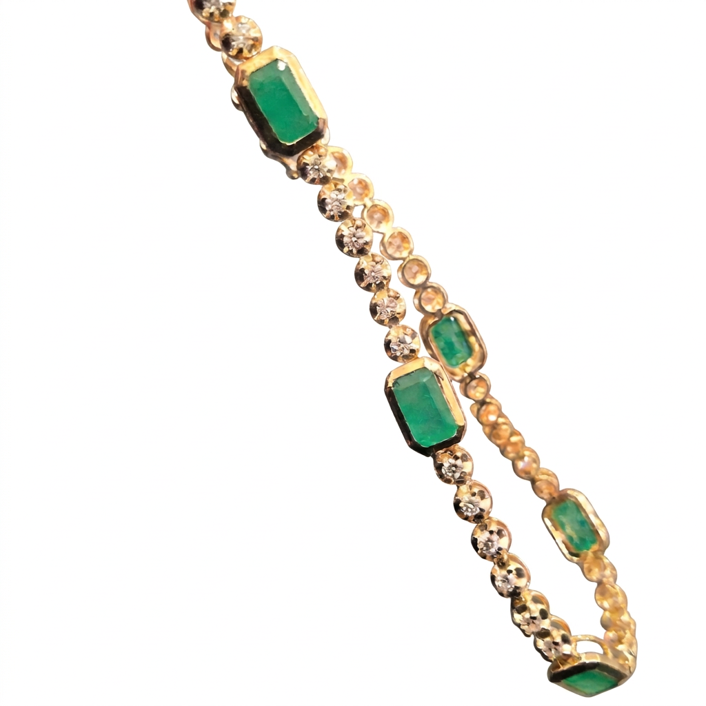 Emerald and Diamond Tennis Bracelet, diagonal detail view on a white background