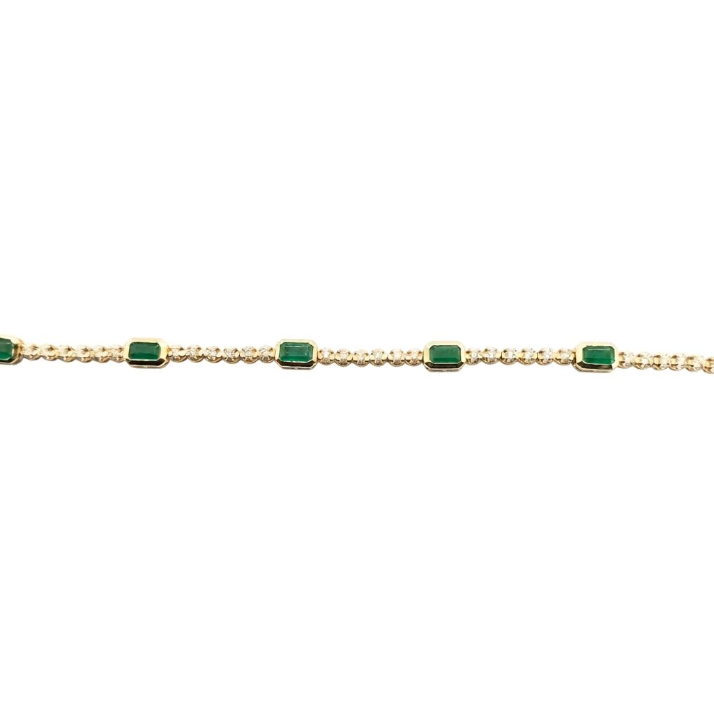 Emerald and Diamond Tennis Bracelet, horizontal detail view on a white background