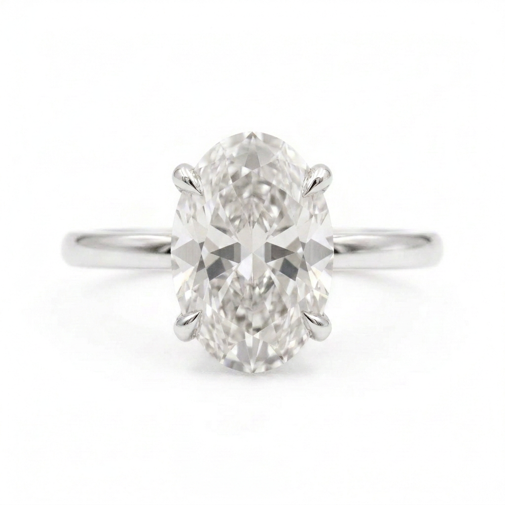 Front view of oval solitaire diamond engagement ring on a white background
