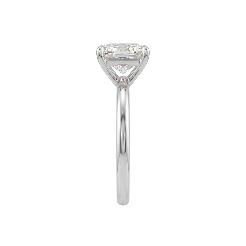 Side profile of a princess-cut diamond engagement ring showing the raised basket setting and polished white-metal band on a white background.