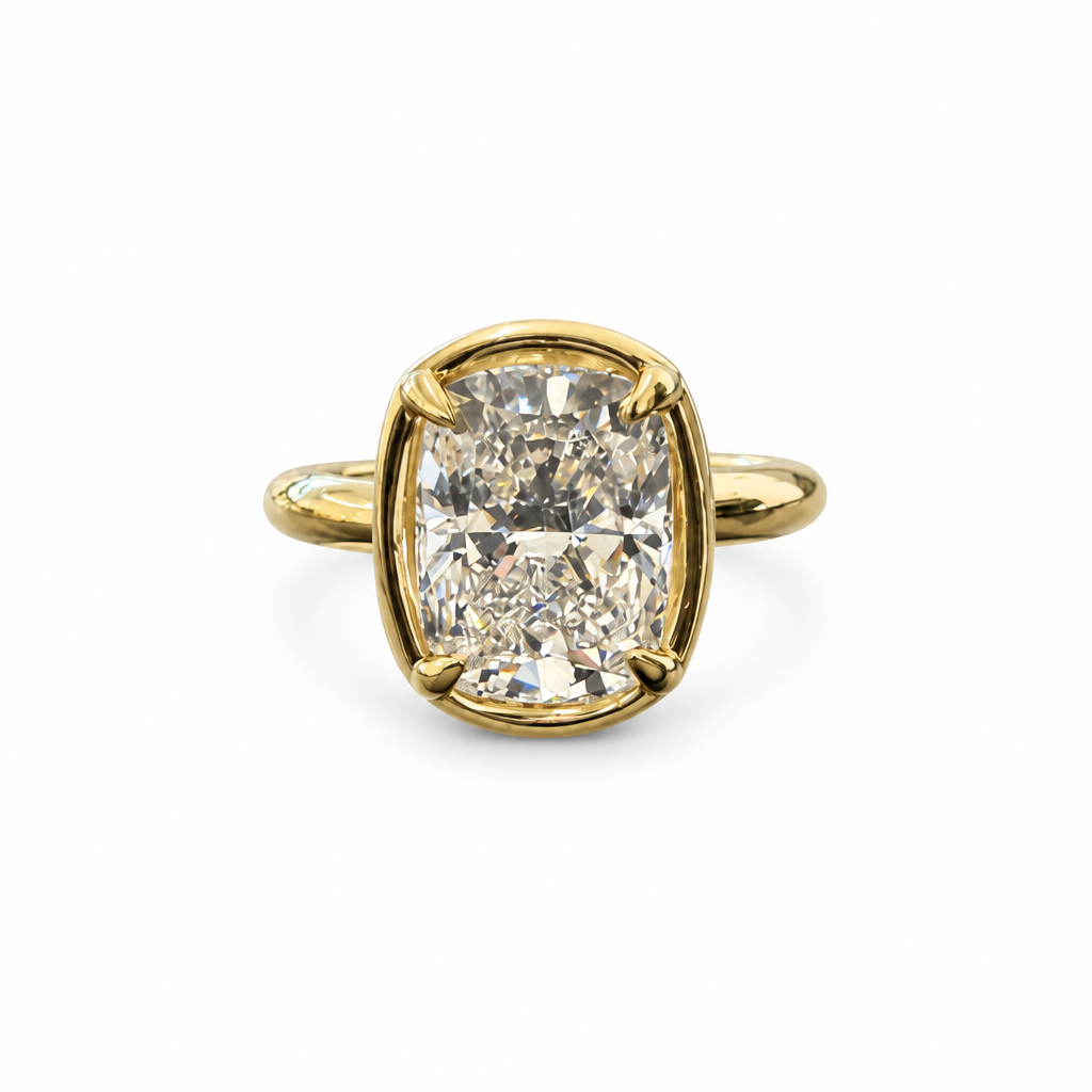 Gold cushion oval diamond ring front view on white background