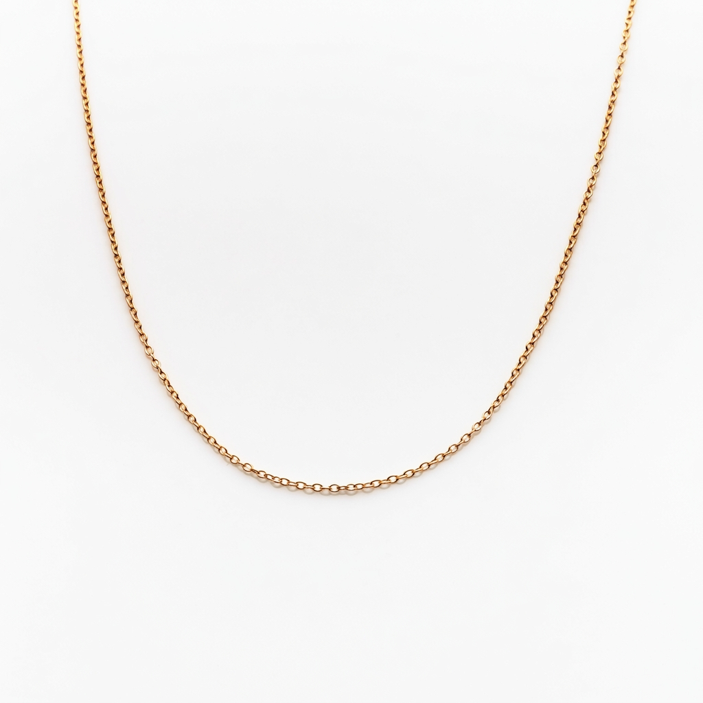 Gold Butter Chain with interlocking oval links draped in a U shape on a white background.